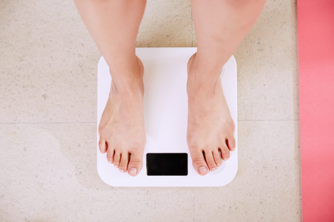 Bare feet on bathroom scale