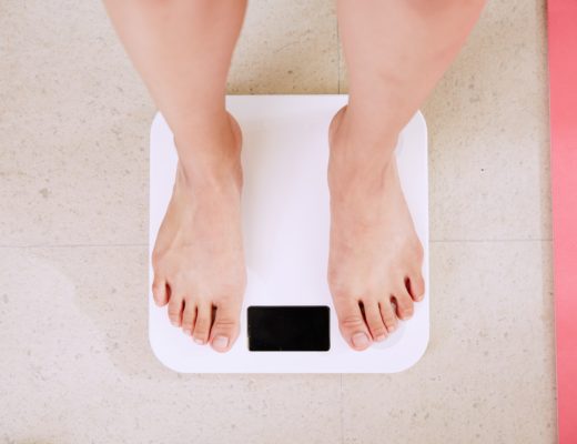 Bare feet on bathroom scale